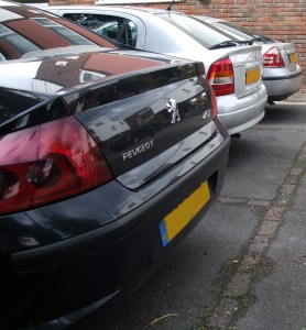 Photograph of some parked cars.